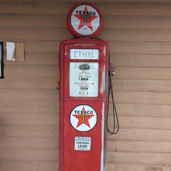 Old Log Cabin - a red gas pump and a texacoo sign - New American Near Me - Pontiac, Illinois Old Log Cabin - a red gas pump and a texacoo sign - New American Near Me - Pontiac, Illinois