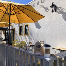 a cafe with yellow umbrellas a cafe with yellow umbrellas