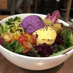 Kale salad with 2 different types of hummus.