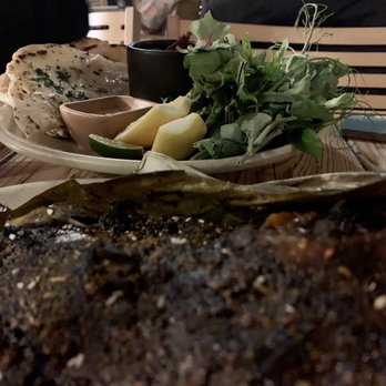 Campfire - Lambs head with house made naan and different garnishes. - New American Near Me - Carlsbad, California Campfire - Lambs head with house made naan and different garnishes. - New American Near Me - Carlsbad, California