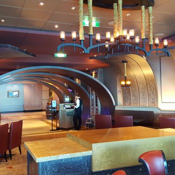 Celebrity Reflection - Tuscany Restaurant. It gives the illusion that the restaurant is in a wine barrel - Boat Tours Near Me - Fort Lauderdale, Florida