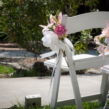 Bloomies Studio - Lovely lilies on the chairs! We asked for 1 lily per chair and they added extra roses! - Florists Near Me - Pleasanton, California