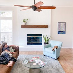 Urbandi - A Rustic Fireplace Mantel really ties the room together.