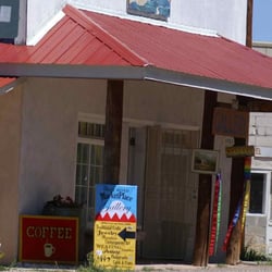 Store is on the west of the highway across from the mural.