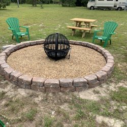 Dreamland RV Park - Fire pit and all lots have picnic tables