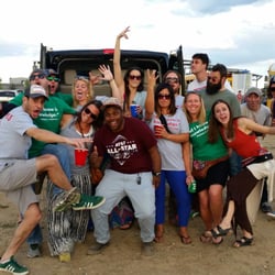 Denver Snow Limo and Tours - The Batmobile is parked at Dick's Sporting Goods Park at the Phish concert. Here I am posing with some customers from the Denver Highlands
