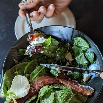 Vermillion 45 - Salade de Chevre Chaud - mixed green salad tossed in a citrus dressing topped with fresh goat cheese, toast, bacon and medjool dates - French Near Me - Kanab, Utah