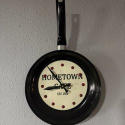 Hometown cafe - A decorative clock bearing the establishments name.