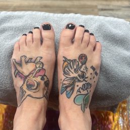 Pedicure with black gel polish.