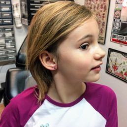 Acne tattoo. Ear piercing by Chris.