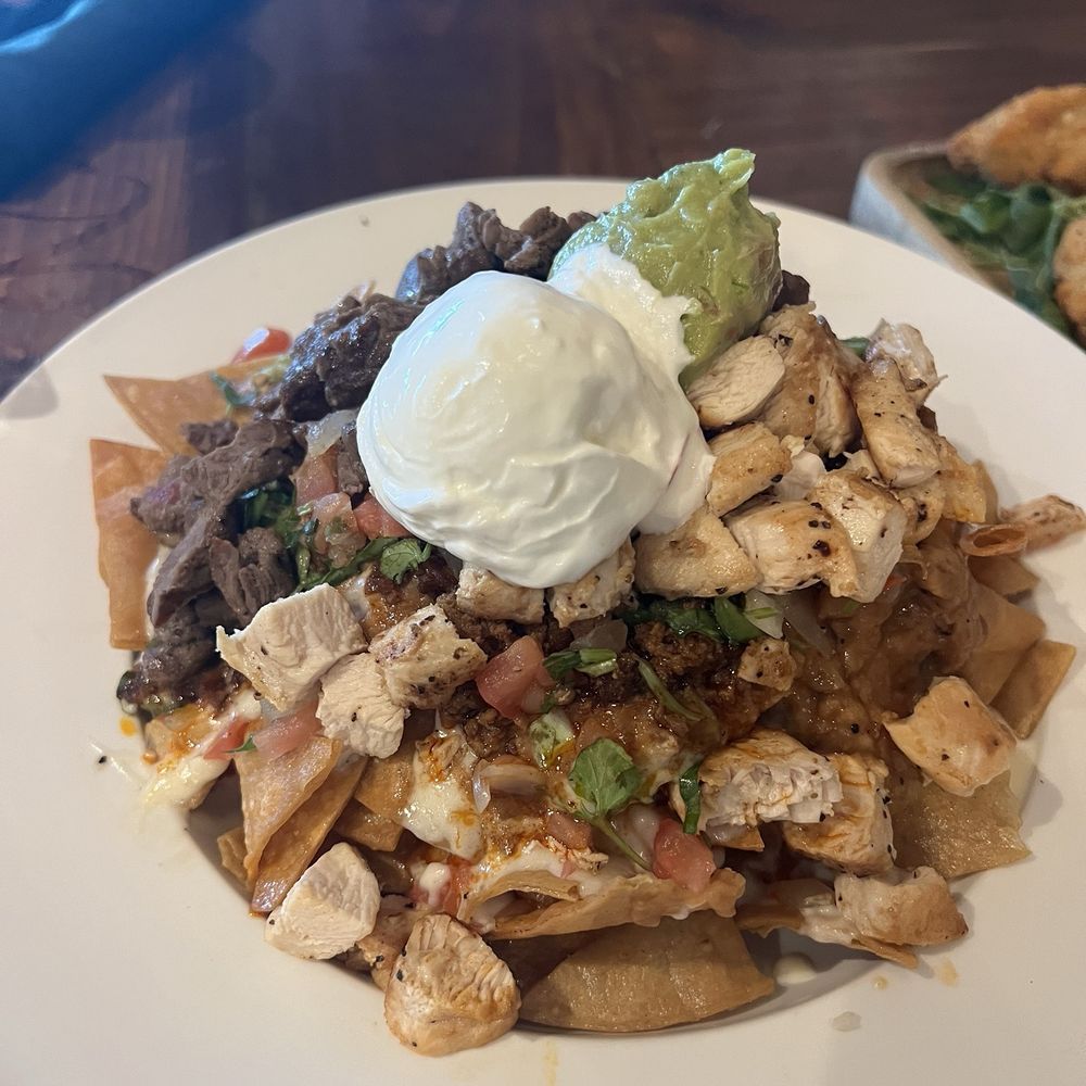 The Local on 50th - Our favorite nachos in the desert!!!! Chicken beef and chorizo on top!! 10/10 - Sports Bars Near Me - Indio, California