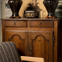 Trouvaille Home - Mid-century arm chair and 18th century French server.