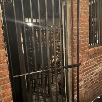 The Hudson House - Entrance to the wine cellar which use to be a jailhouse in the building of the village hall - New American Near Me - Nyack, New York