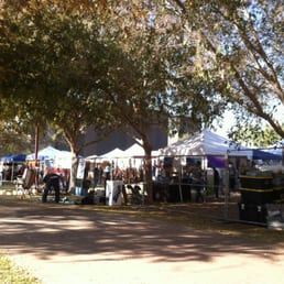 Shaded booths on south side with artists at work