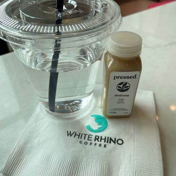 White Rhino Coffee - Pressed ginger, lemon cayenne shot at the Togo station for purchase - Coffee & Tea Near Me - Dallas, Texas