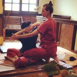 Cheri Neal, LMT - Cheri practicing Thai Yoga Massage on client