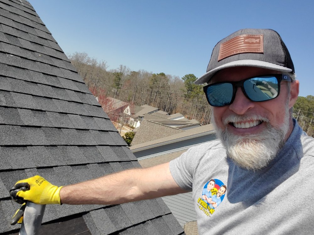 Slide of Tom and Jerry's Roofing