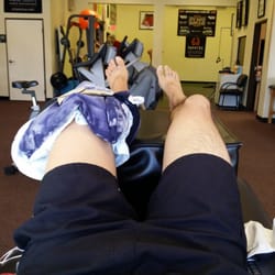Synergy Physical Therapy & Sports Performance - Iced knee sandwich.