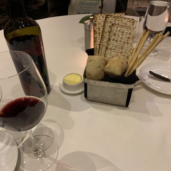 Rugby Grille - Lovely complimentary bread basket! Zinfandel wine- super wonderful - American Near Me - Birmingham, Michigan