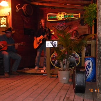 Frontier Outpost - a man playing guitar and a woman playing guitar - Campgrounds Near Me - Fredericksburg, Texas Frontier Outpost - a man playing guitar and a woman playing guitar - Campgrounds Near Me - Fredericksburg, Texas