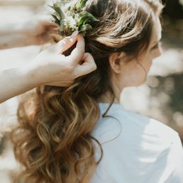 Natural loose curls with greenery Natural loose curls with greenery