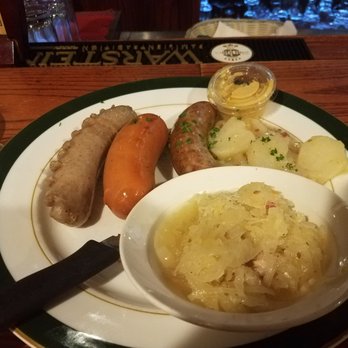 Das Schnitzel Haus - Wurst platter with German potato salad and sauerkraut - German Near Me - Parma, Ohio Das Schnitzel Haus - Wurst platter with German potato salad and sauerkraut - German Near Me - Parma, Ohio