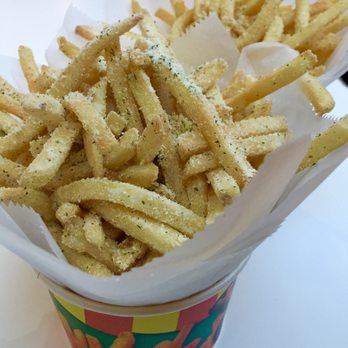 Potato Corner - Mega regular fries in sour cream and onion and garlic parme in the back - Fast Food Near Me - Santa Clara, California