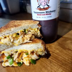 Buffalo chicken mac-n- grilled cheese! Smoked pulled chicken, Buffalo sauce, American cheese, smoked gouda mac, jalapeños on Texas Toast.