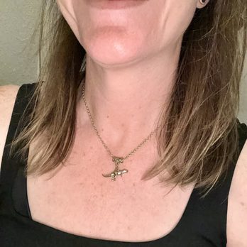 The Mellow Makery ATX - I bought the dinosaur necklace because I just had to have it! Look how happy it made me - Commissioned Artists Near Me - Austin, Texas The Mellow Makery ATX - I bought the dinosaur necklace because I just had to have it! Look how happy it made me - Commissioned Artists Near Me - Austin, Texas