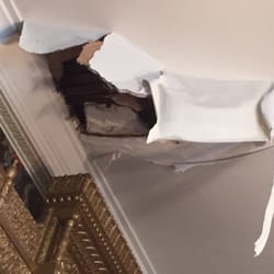 Jake & Son - Hole in a plaster ceiling with sheetrock on top.