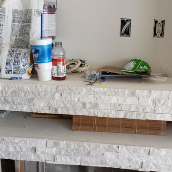 Elite Tile Pros - a white brick fireplace - Tiling Near Me Elite Tile Pros - a white brick fireplace - Tiling Near Me