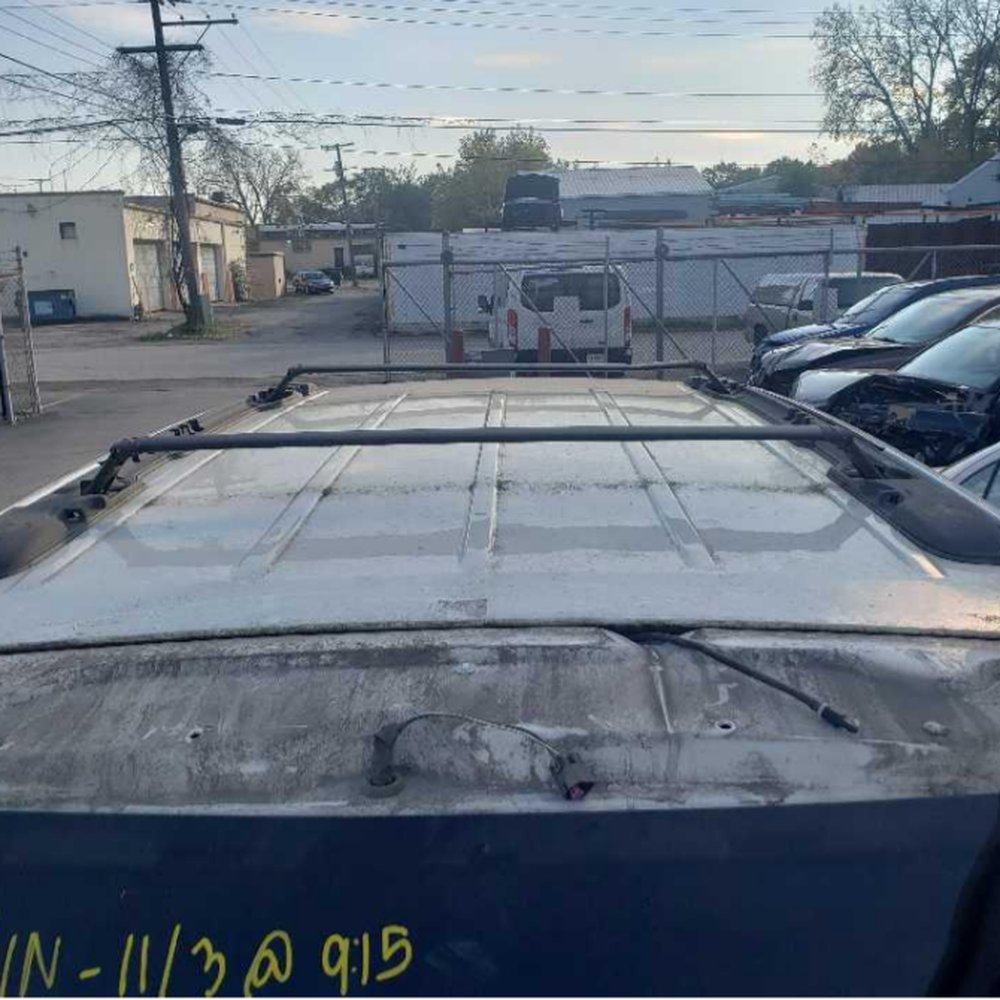 Gerber Collision & Glass - The spoiler on the liftgate removed. As you can see, bolts were removed, that can only be accessed if the door is open. - Body Shops Near Me - Gary, Indiana