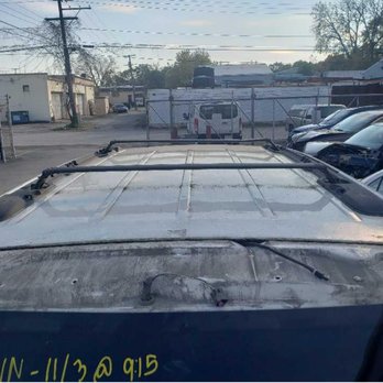 Gerber Collision & Glass - The spoiler on the liftgate removed. As you can see, bolts were removed, that can only be accessed if the door is open. - Body Shops Near Me - Gary, Indiana