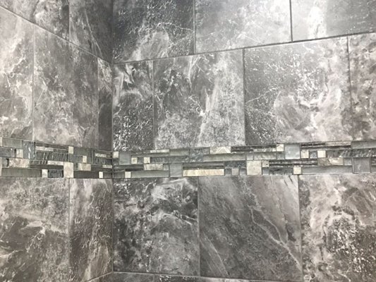 Elevate Your Space with D&K Tile Installation's Expert Tile & Design Services - At D&K Tile Installation, we don’t just install tiles – we create stunning designs that transform your space into something extraordinary. Whether you're renovating your kitchen, bathroom, or living area, our team of skilled professionals works with you every step of the way to ensure your vision becomes a reality. We offer a wide variety of tile options, from classic ceramic and porcelain to luxurious natural stone and modern glass tiles, all tailored to suit your unique style.

Our design services go beyond just selecting tiles. We take the time to understand your needs, blending functionality with aesthetic appeal. Whether you’re looking for a bold feature wall, intricate mosaic patterns, or a clean, minimalist design, our team ensures your space not only looks beautiful but also feels cohesive and welcoming.

Why Choose D&K Tile Installation for Your Tile & Design Project?

Comprehensive Design Consultation: We offer personalized design services to help you select the perfect tile style, layout, and color palette that complements your home.
Expert Installation: Our experienced installers guarantee a flawless finish, ensuring that every tile is placed with precision and care.
Custom Solutions: Whether it’s a custom backsplash, floor-to-ceiling wall design, or an elegant shower surround, we specialize in creating tailored designs that fit your needs and preferences.
Quality Materials: We use only the highest-quality tiles and materials, ensuring a beautiful, durable result that enhances the longevity of your investment.
Affordable & Transparent Pricing: We provide quality craftsmanship at competitive prices, with clear, upfront quotes so you know exactly what to expect.
From classic to contemporary, simple to intricate, D&K Tile Installation is dedicated to delivering high-end tile designs and installation services that leave a lasting impression. Let us help you bring your dream space to life with our exceptional tile and design solutions.