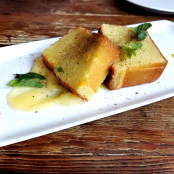 Coltivare - Olive oil cake, lemon curd, and orange zest - Italian Near Me - Houston, Texas Coltivare - Olive oil cake, lemon curd, and orange zest - Italian Near Me - Houston, Texas
