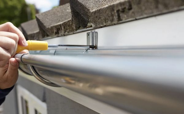 Gutter Services - At First Class Roofing Inc., we understand the critical role that gutters play in protecting your home or business from water damage. Our expert team in Greensboro, NC, is dedicated to providing high-quality gutter installation services that ensure effective water management and enhance the longevity of your property. Whether you need new gutters installed or an upgrade to your existing system, we have the solutions you need. Gutter Services - At First Class Roofing Inc., we understand the critical role that gutters play in protecting your home or business from water damage. Our expert team in Greensboro, NC, is dedicated to providing high-quality gutter installation services that ensure effective water management and enhance the longevity of your property. Whether you need new gutters installed or an upgrade to your existing system, we have the solutions you need.