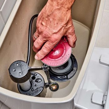 Shields Plumbing - a man's hand opening a toilet - Plumbing Near Me - Citrus Heights, California Shields Plumbing - a man's hand opening a toilet - Plumbing Near Me - Citrus Heights, California