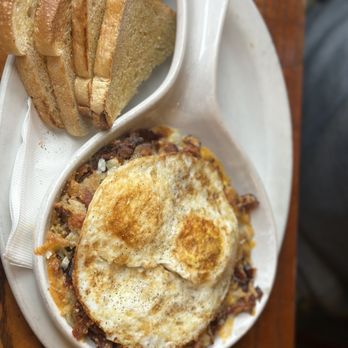 Stacks - Skillet bacon and onions with over hard eggs with side of sourdough toast. - Breakfast & Brunch Near Me - Burlingame, California Stacks - Skillet bacon and onions with over hard eggs with side of sourdough toast. - Breakfast & Brunch Near Me - Burlingame, California