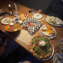 Mozzarella sticks, side salad, Greek pizza, quesadillas, potato skins, and prime rib dip.