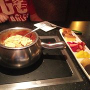 Photo of The Melting Pot - Fort Collins, CO, United States. S'more fondu. The stuff on top is crumbled up gram crackers.