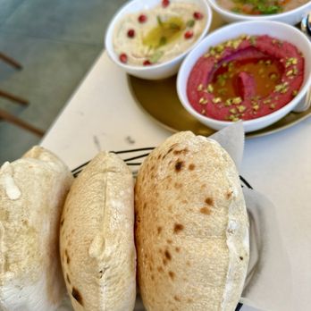 Ammatoli - fresh pita and beet hummus with pistachio, roasted eggplant Muhammara Mezza, and Foul Mudammas Mezza aka bean dip - Mediterranean Near Me - Long Beach, California Ammatoli - fresh pita and beet hummus with pistachio, roasted eggplant Muhammara Mezza, and Foul Mudammas Mezza aka bean dip - Mediterranean Near Me - Long Beach, California