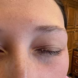 Poshe Salon - Adhesive stuck in her lashes.