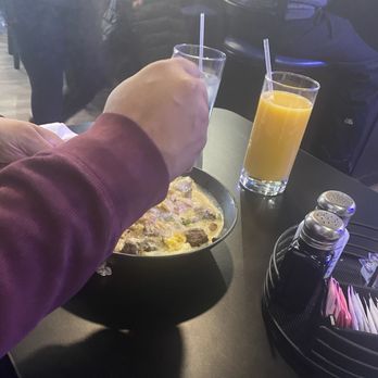 Fraîche Brunch Bar - Gouda Grits Bowl with steak. My brother didn't know I was taking a picture! - Breakfast & Brunch Near Me - Cleveland Heights, Ohio