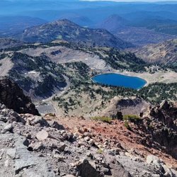 Lassen Peak Trail - A view from the peak looking down at Lake Helen.