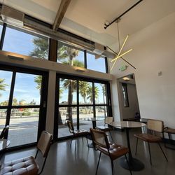 Academic Coffee - Indoor seating area with a lot of nice natural light and views to the park beside the shop