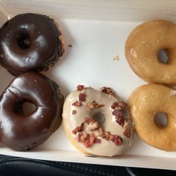 Mercy's Daylight Donuts - The Maple glazed with bacon sprinkles is my favorite. Light & fluffy raised donuts - choc & glazed- just the right size.