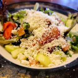 Victoria's Steakhouse and Mexican Grill - Side salad: cucumbers, tomatoes, strawberries, a delicious balsamic and queso fresco crumbles