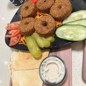 THE DOUGH SHOW - Tampa - Falafel! Super crispy fried and well seasoned! Came with veggies and a sauce similar to sour cream and regular not fresh made pitas. - Middle Eastern Near Me - Tampa, Florida THE DOUGH SHOW - Tampa - Falafel! Super crispy fried and well seasoned! Came with veggies and a sauce similar to sour cream and regular not fresh made pitas. - Middle Eastern Near Me - Tampa, Florida
