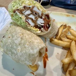 Chicken wrap with buffalo sauce on side Chicken wrap with buffalo sauce on side