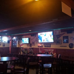 The Huddle Bar & Grill - Bar interior.